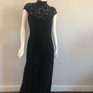 Woman’s long black sleeveless dress